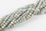 Natural Matte finished faceted blue aquamarine beads. Matte finished faceted round 6mm, 7mm, 8mm, 10mm, 12mm. Full strands 15.5"