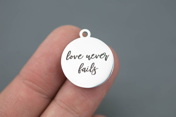 Stainless Steel Charms -- Love never fails - Laser Engraved Silver Tone - Bulk Pricing