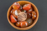 Natural Carnelian Tumbled Nuggets- 100 grams-3.5 ounces - .5 inch-1.25 inch Size- Roughly 25 pcs per bag Pre-charged