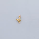 May include: A gold-colored banana charm pendant with small, clear gemstones. The charm is detailed with a curved shape and a loop for attaching to a necklace or bracelet. The background is a solid, light gray color.