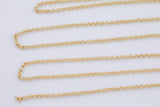 May include: Four gold-colored chain necklaces with a delicate, circular link design. The chains are arranged diagonally across a white background, showcasing their length and intricate details. The chains are likely made of metal.