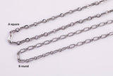 May include: Close-up of three silver-colored chain necklaces. The top chain has square links, while the bottom chain has round links. The middle chain has oval links. The chains are displayed on a white surface.