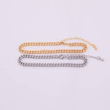 May include: Two chain bracelets, one gold-toned and one silver-toned, are displayed against a white background. Each bracelet features a curb chain design with an adjustable length. The gold bracelet is positioned above the silver one.