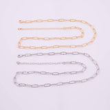 May include: Two chain necklaces, one gold-toned and one silver-toned, are displayed against a white background. Each necklace features a textured, elongated oval link design. The gold chain is positioned above the silver chain.