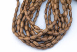 Wood Rice Shape Beads 7x14mm- 15 inches per strand