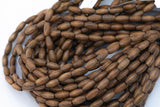 Wood Rice Shape Beads 7x14mm- 15 inches per strand