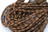 Wood Rice Shape Beads 7x14mm- 15 inches per strand
