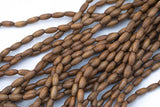 Wood Rice Shape Beads 7x14mm- 15 inches per strand