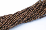 Wood Rice Shape Beads 5x7mm- 15 inches per strand